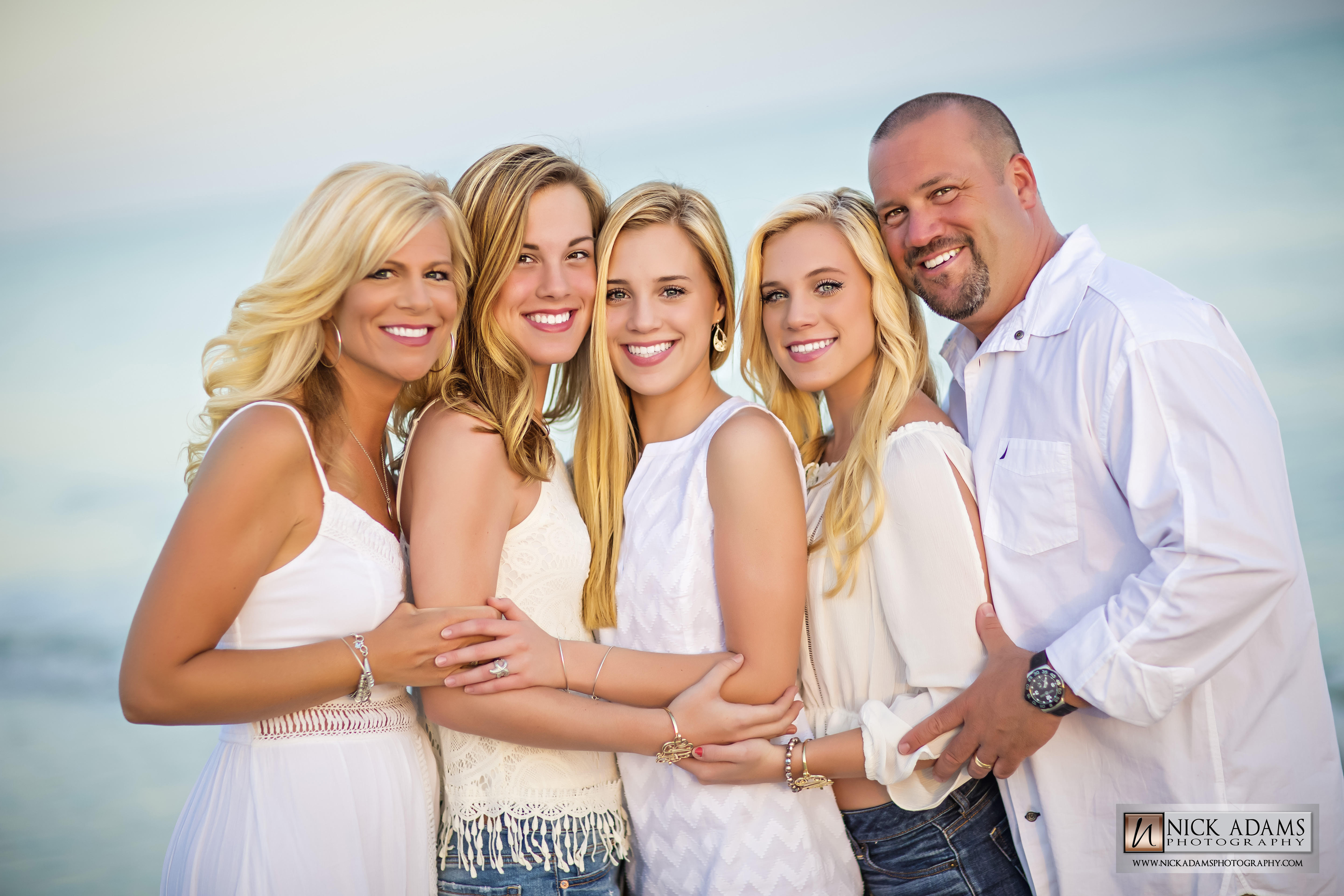 Family posing on the beach