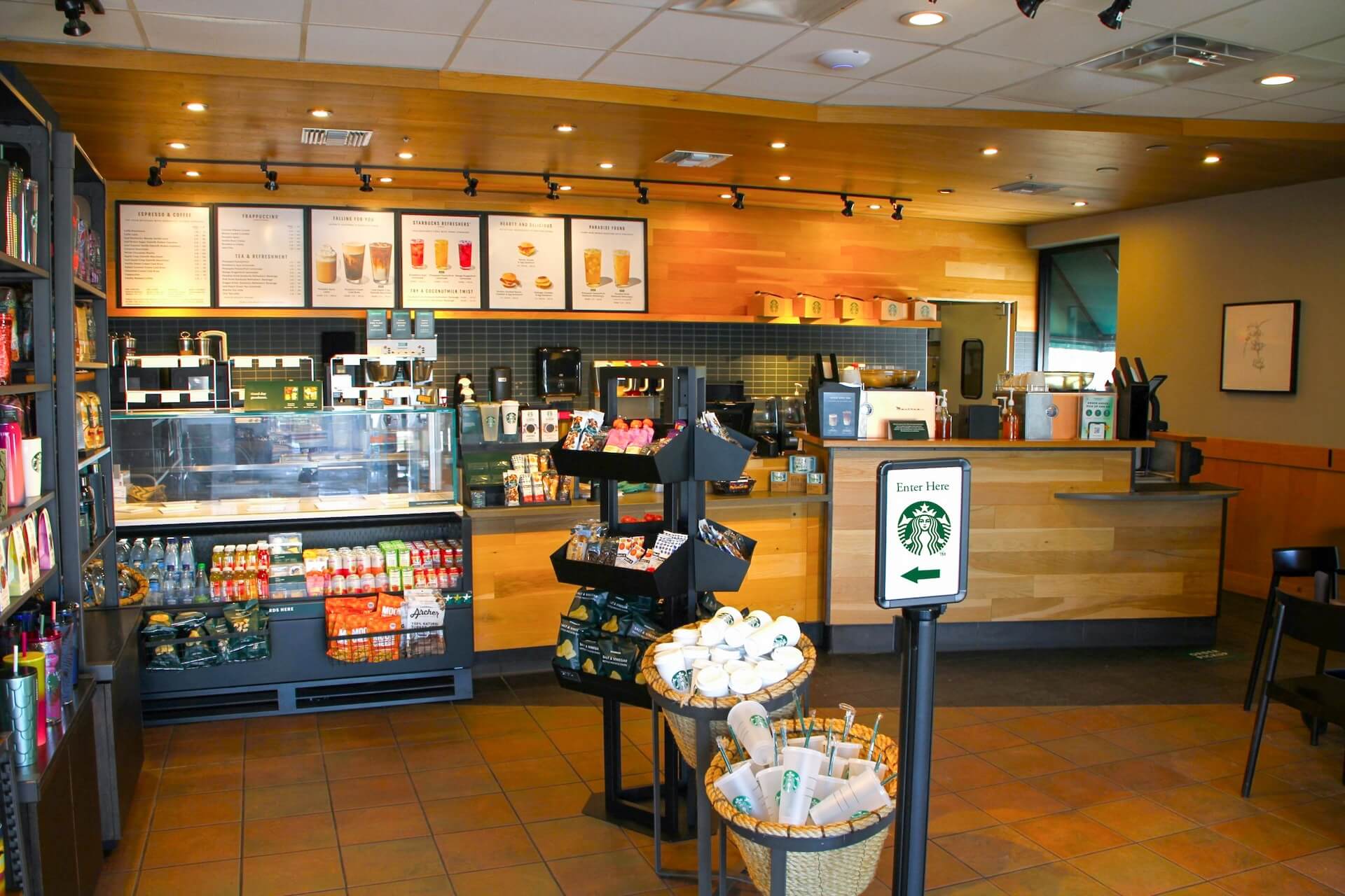 Starbucks counter and seating area with menu boards