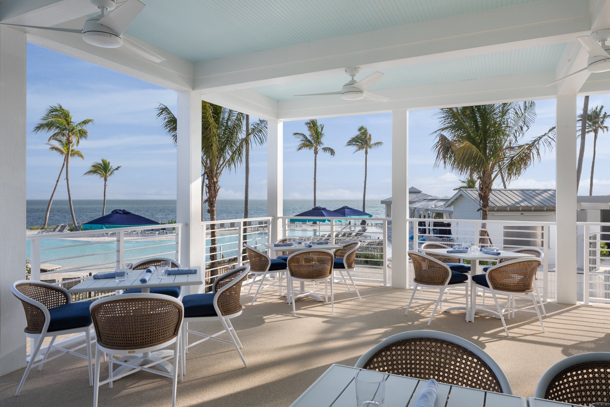 Outdoor dining area with ocean views at South Seas