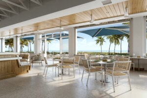 Coastal restaurant patio with tables and ocean views