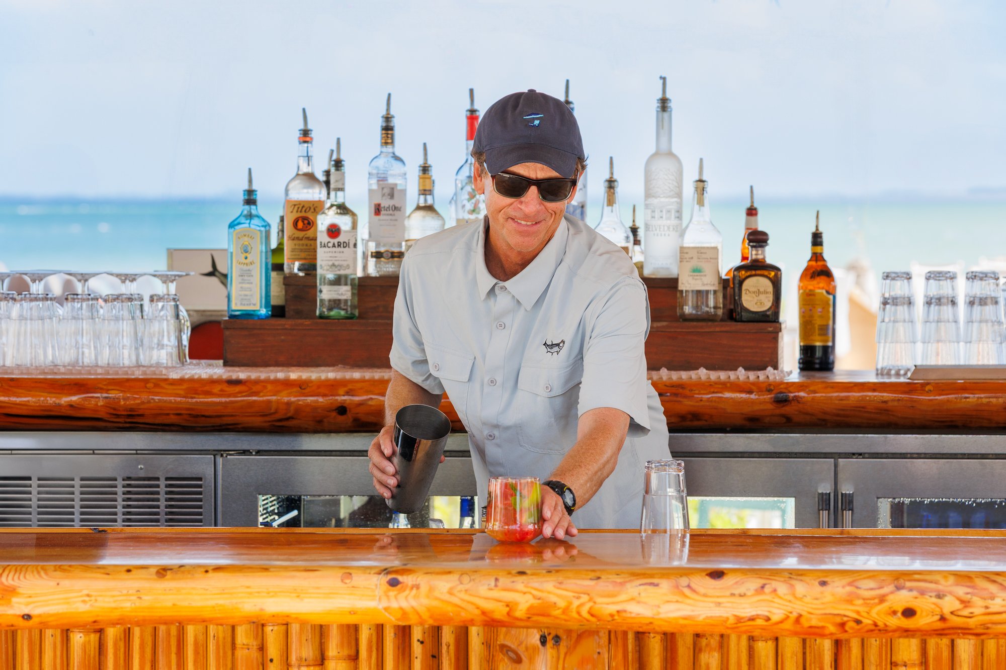 Bartender making drinks at a beach bar