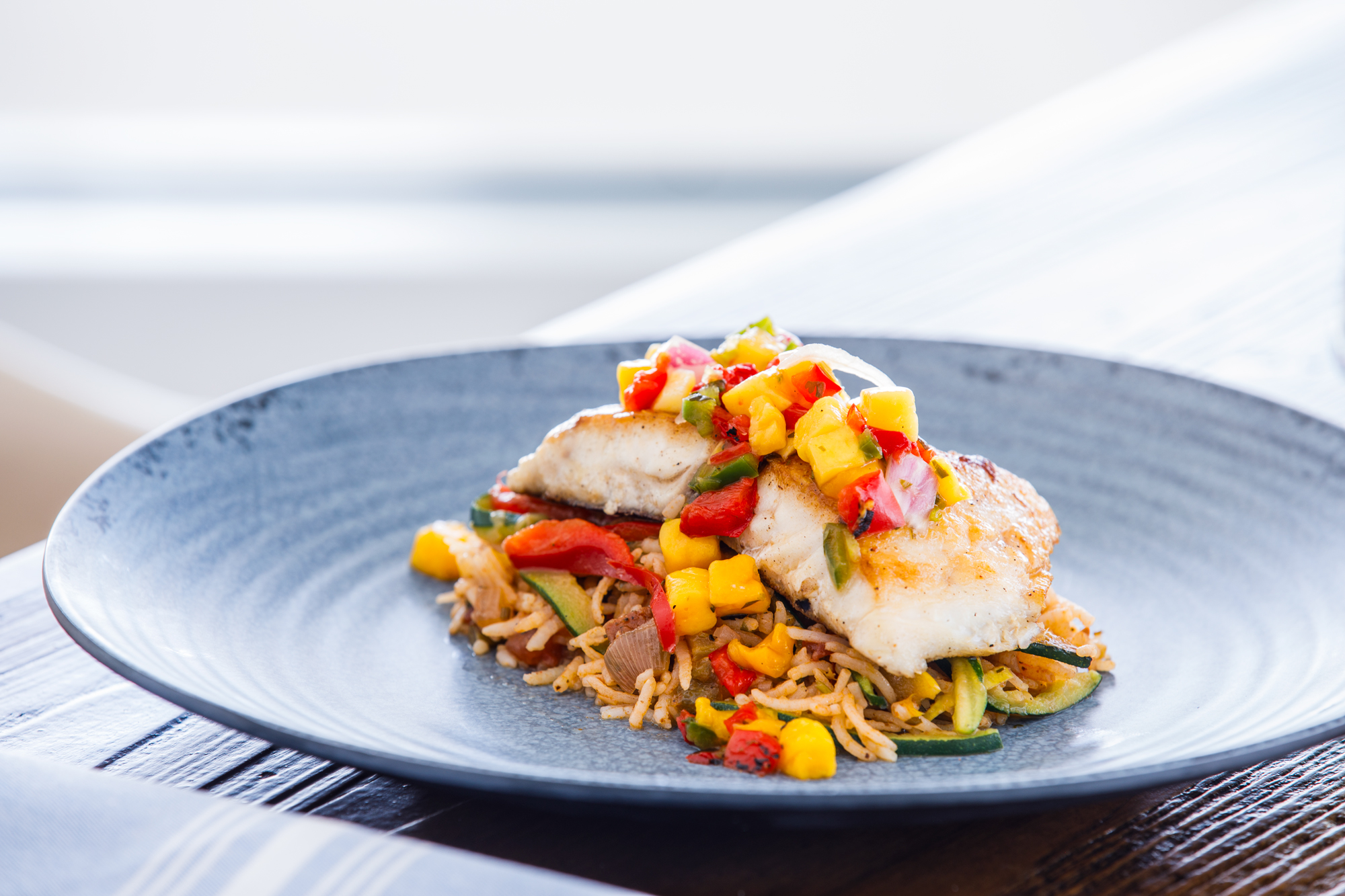 Gourmet fish dish with vegetables at South Seas