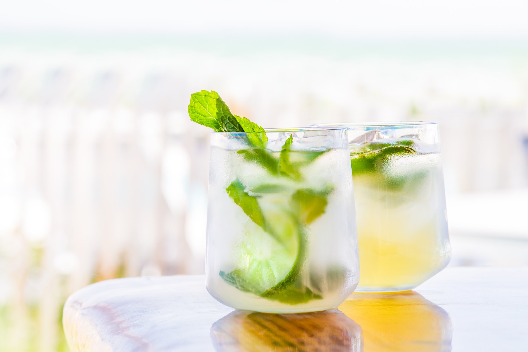 Refreshing cocktail with mint and lime by the beach
