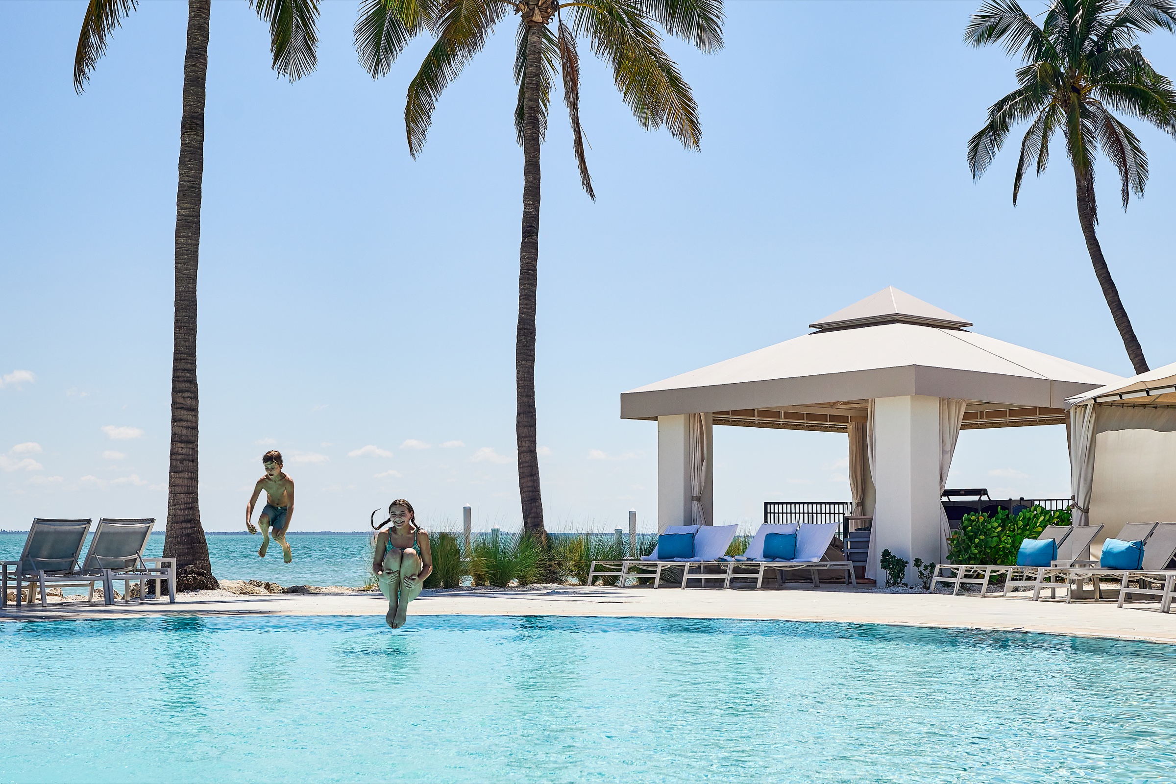 Children jumping into a pool at South Seas
